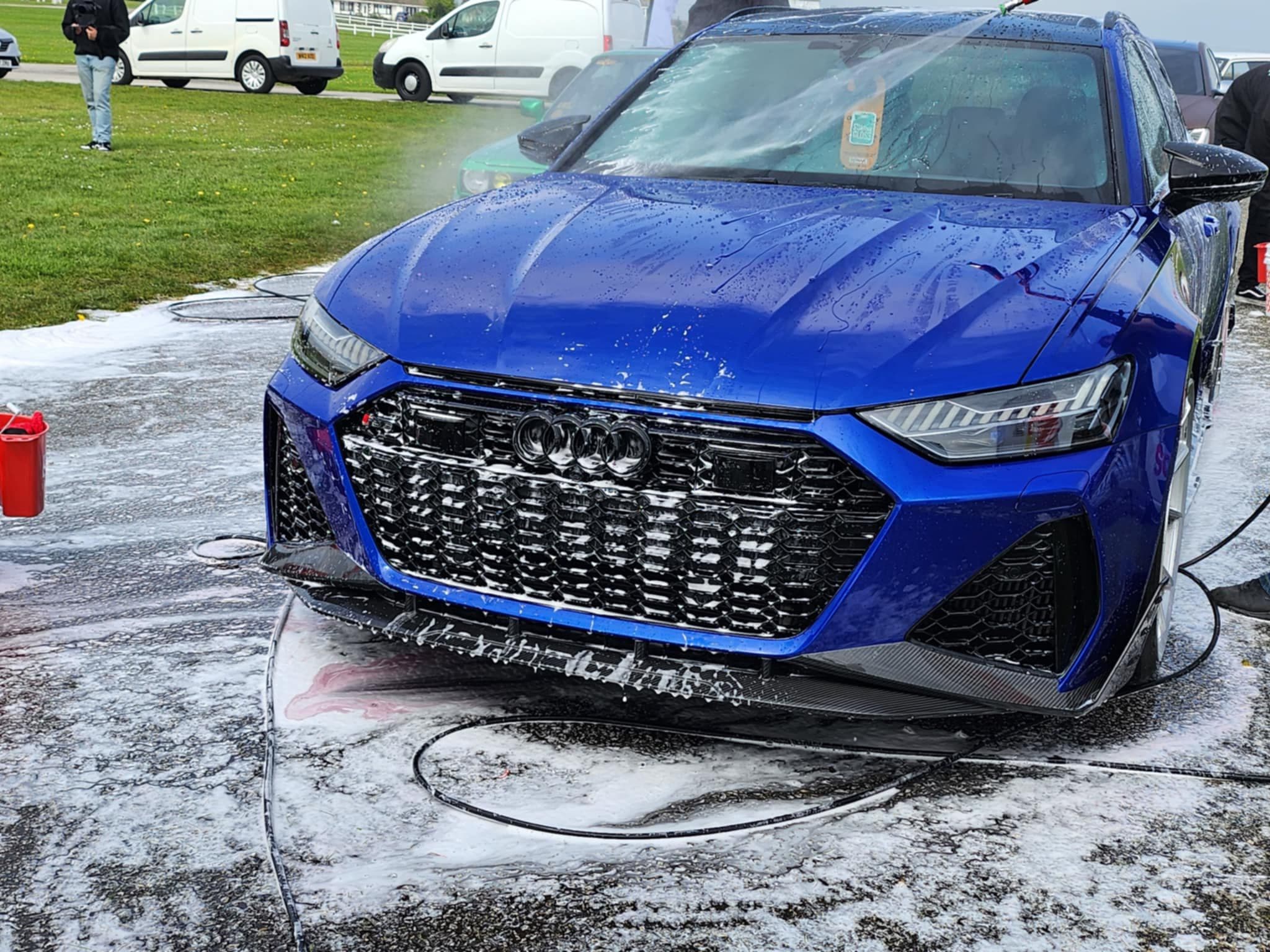 Blue Audi RS being foam washed at car show